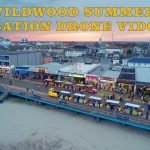 The Wildwood Boardwalk on a warm summer evening with two tramcars going by