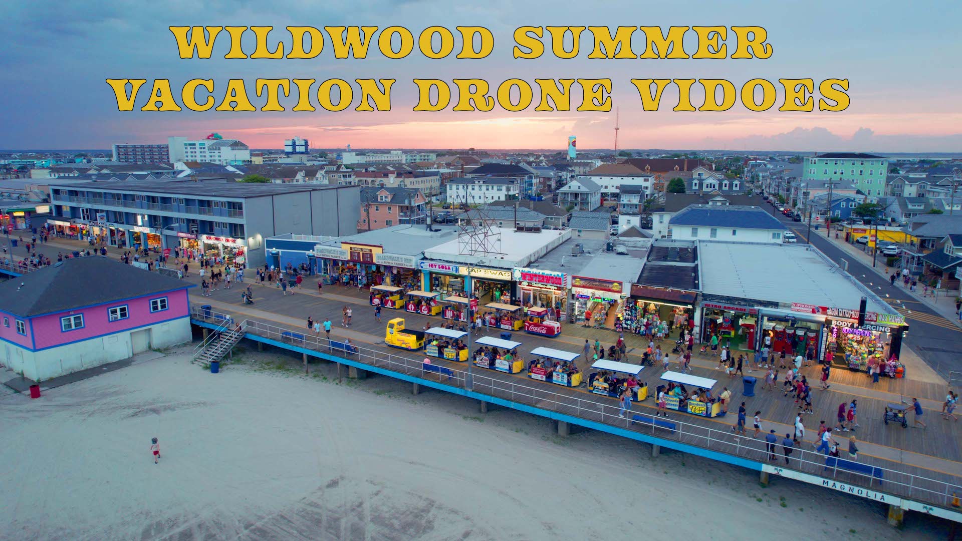 The Wildwood Boardwalk on a warm summer evening with two tramcars going by